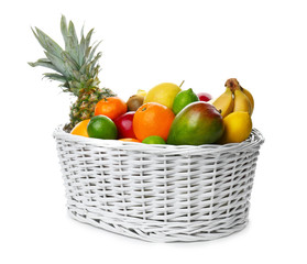 Basket with fresh tropical fruits on white background