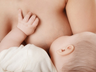 mother breast feeding her newborn baby