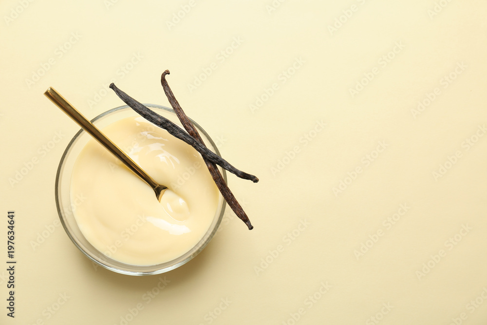Sticker vanilla pudding and sticks on color background