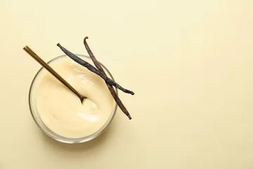 Fotobehang Vanilla pudding and sticks on color background © New Africa