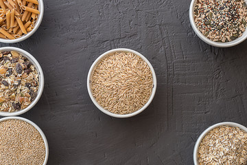 Quinoa, brown rice, seeds and oats . Whole grain and organic food concept for vegetarians