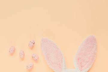 Easter holiday background with bunny ears and easter eggs