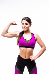 Obraz premium Portrait of a smiling sports woman flexing biceps and looking at camera isolated over white background