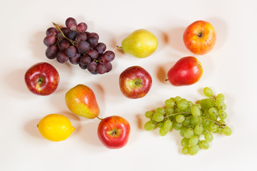 Colorful food pattern made of apples, pears, lemon and grape