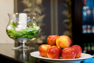  Red apples with a headdress in the background