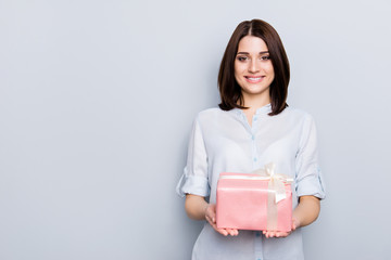 Fototapeta premium People person delight bliss feelings party concept. Portrait of beautiful charming attractive cute tender gentle lovely business lady with present in hands isolated on gray background copy-space