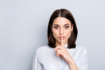 Fototapeta na wymiar Shh shy sly people person modern concept. Close up portrait of cute lovely attractive uncertain unsure with stylish hairdo entrepreneur making hush gesture isolated on gray background copy-space