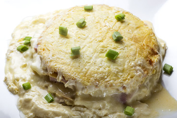 Baked cake made from ham, eggs, cheese and sour cream