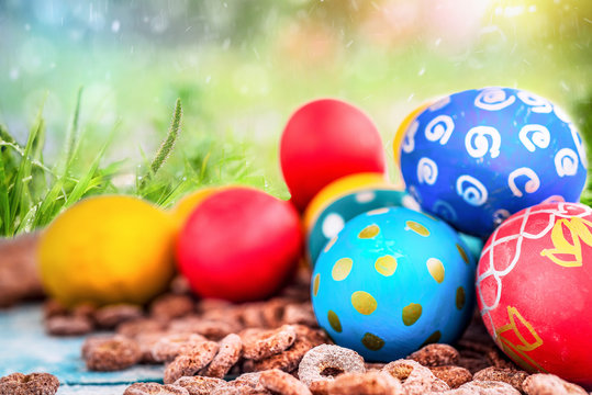 Easter colored eggs on a background of green grass. Happy Easter