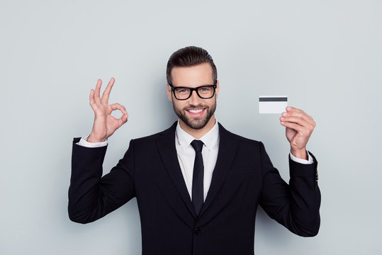 Online internet perfect deal finance consumerism purchase bargain system commerce concept. Smart expert confident cheerful excited agent demonstrating okay symbol plastic card isolated gray background