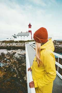 Woman sightseeing Norway lighthouse Travel Lifestyle exploring concept wanderlust vacations outdoor girl tourist standing alone