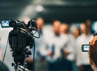 Camera at media conference