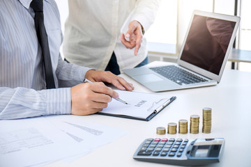 Real estate broker residential agent being analysis and making the decision a home estate loan to...