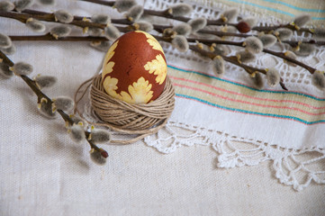 The painted egg and willow twigs. Easter day.