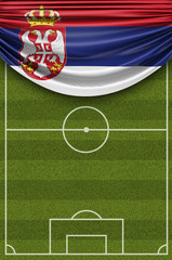 Serbia country flag draped over a football soccer pitch. 3D Rendering