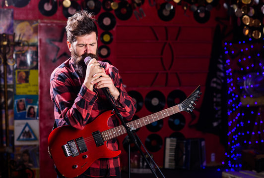 Man with shouting face play guitar, singing song, play music,