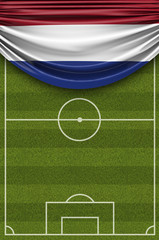 Netherlands country flag draped over a football soccer pitch. 3D Rendering