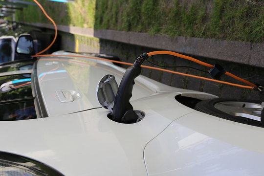 Electric Car Power Supply charging on charge station electro mobility environment friendly