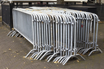 Crowd control barriers and yelow leaves around