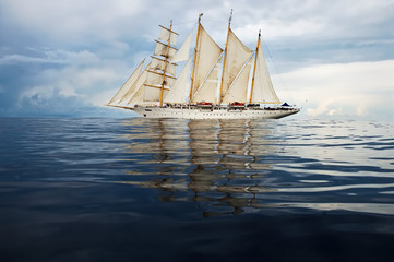 Sailing ship and storm sky. Cruises. Yachting. Sailing