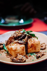 Deep Fried chinese style Tofu with Fried herbs and Shiitake mushroom.