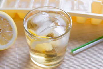 Green tea with ice and lemon in a glass