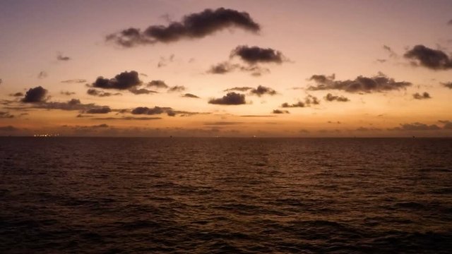 offshore time apse sunset day to night