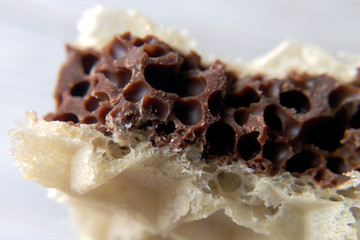 Waffle in chocolate macro photography blurred background closeup