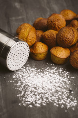 Cupcake set next to a sugar bowl.
