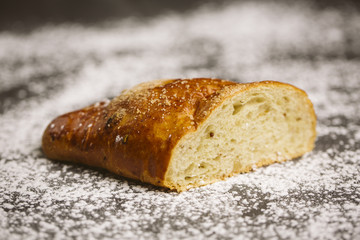 Sugar bun on a wooden background.