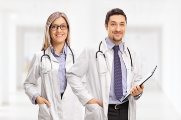 Female doctor and a male doctor with a clipboard