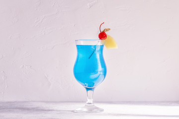 Blue Curacao cocktail decorated with fruit.