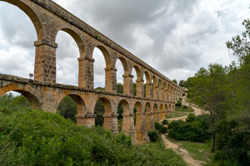 Obraz premium Roman Aqueduct Pont del Diable in Tarragona, Spain