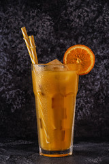 Cocktail with orange juice and ice cubes