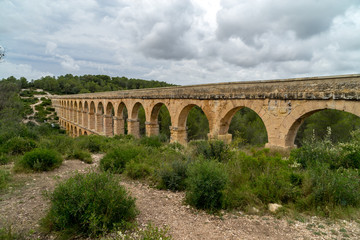 Fototapeta na wymiar Roman Aqueduct Pont del Diable in Tarragona, Spain