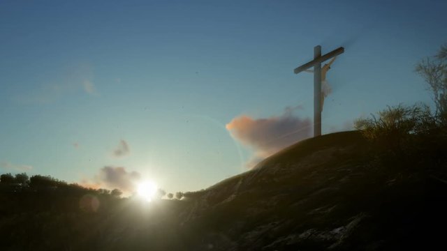 Christian woman praying at Jesus cross at sunrise, zoom out