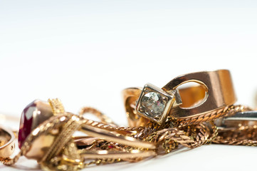Real gold rings with diamond , gold chain isolated on white background.