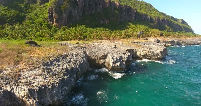 Aerial drone bird's eye view video on sea waves and rocks, turquoise water. tropical paradise pacific atoll islands. Top view. Shot in 4k