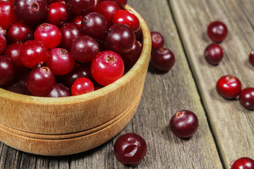 Cranberries in a wooden cup