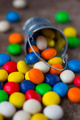 Colorful candy in a small metal bucket