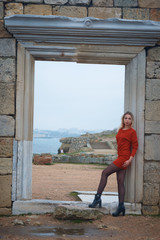 Obraz premium Young hot sexy woman in a short red dress outdoors