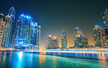 Fototapeta na wymiar Evening on canal and promenade in Dubai Marina,Dubai,United Arab Emirates