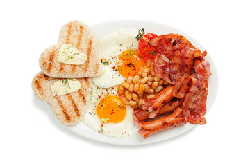 Traditional full English breakfast with fried eggs, sausages, beans, grilled tomatoes and bacon.isolated on white background.