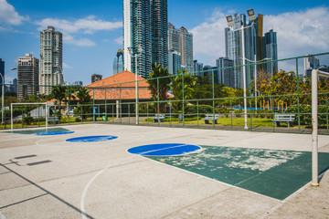 Fototapeta na wymiar sports field, basketball court with city background