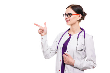 Young beautiful female doctor showing sign on white background