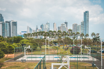 basketball and soccer court outdoor with city skyline background