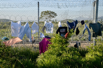 Idomeni, Greece, April 15, 2016 -  Drying the laundry on a barbed wire at the border. The camp for...