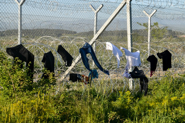 Idomeni, Greece, April 15, 2016 -  Drying the laundry on a barber wire at the border. The camp for...