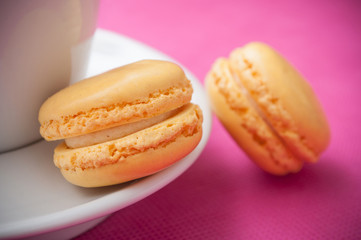 closeup of french macarons pastry on pink background