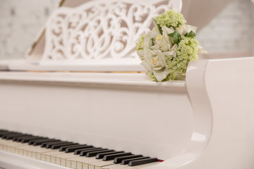 cool white piano in a white interior
